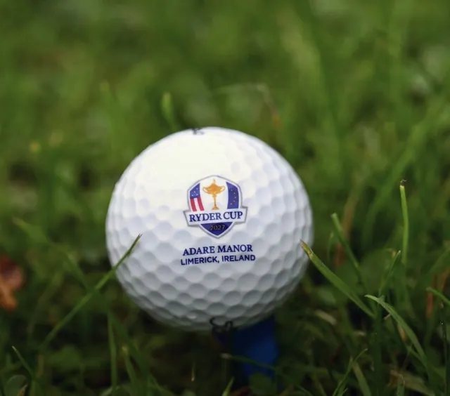 Ryder Cup 2027 golf ball printed Adare Manor Limerick Ireland on a blue tee in grass