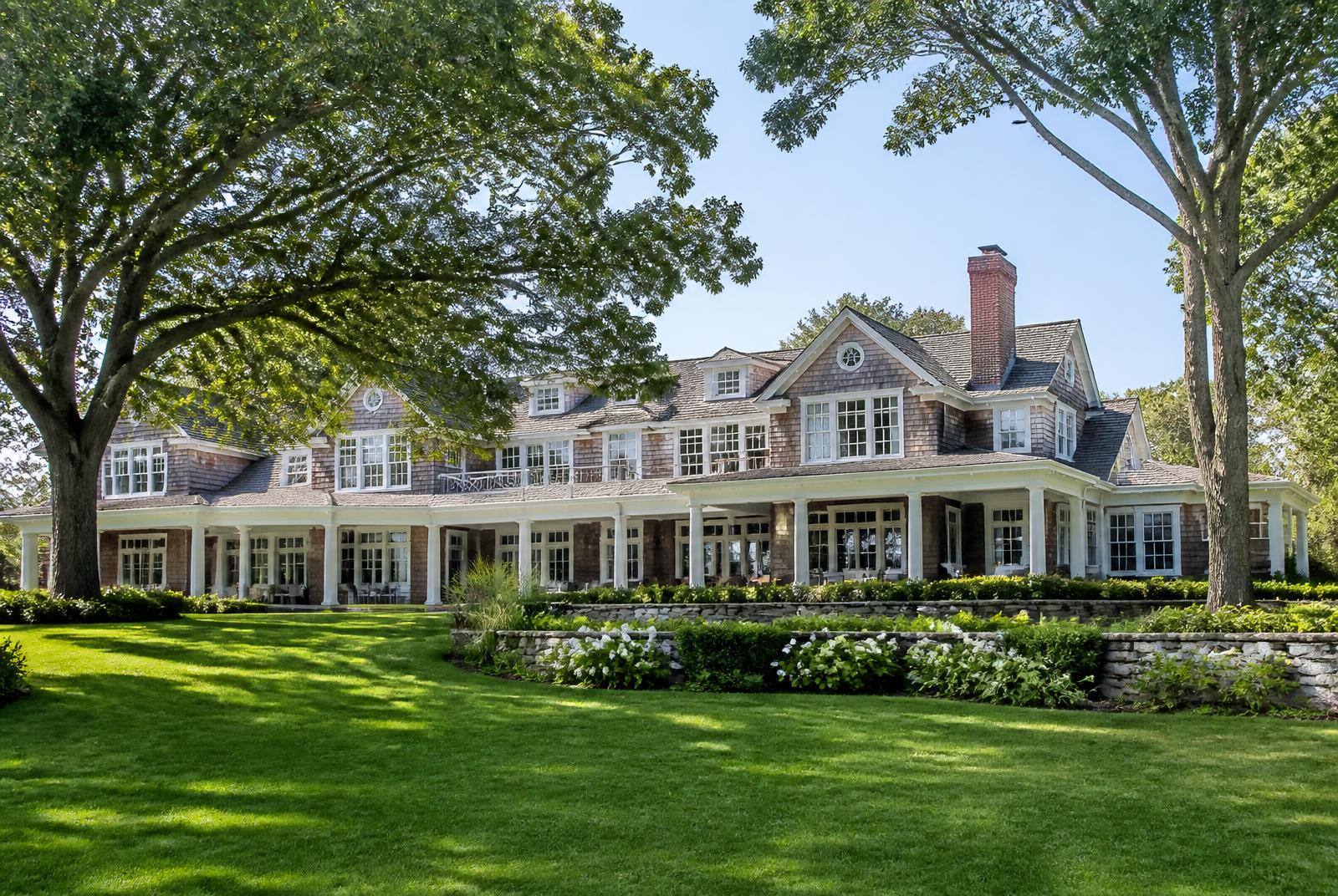 Large shingle style estate residence with wide porch and lawns, suited to large group accommodation in Westchester